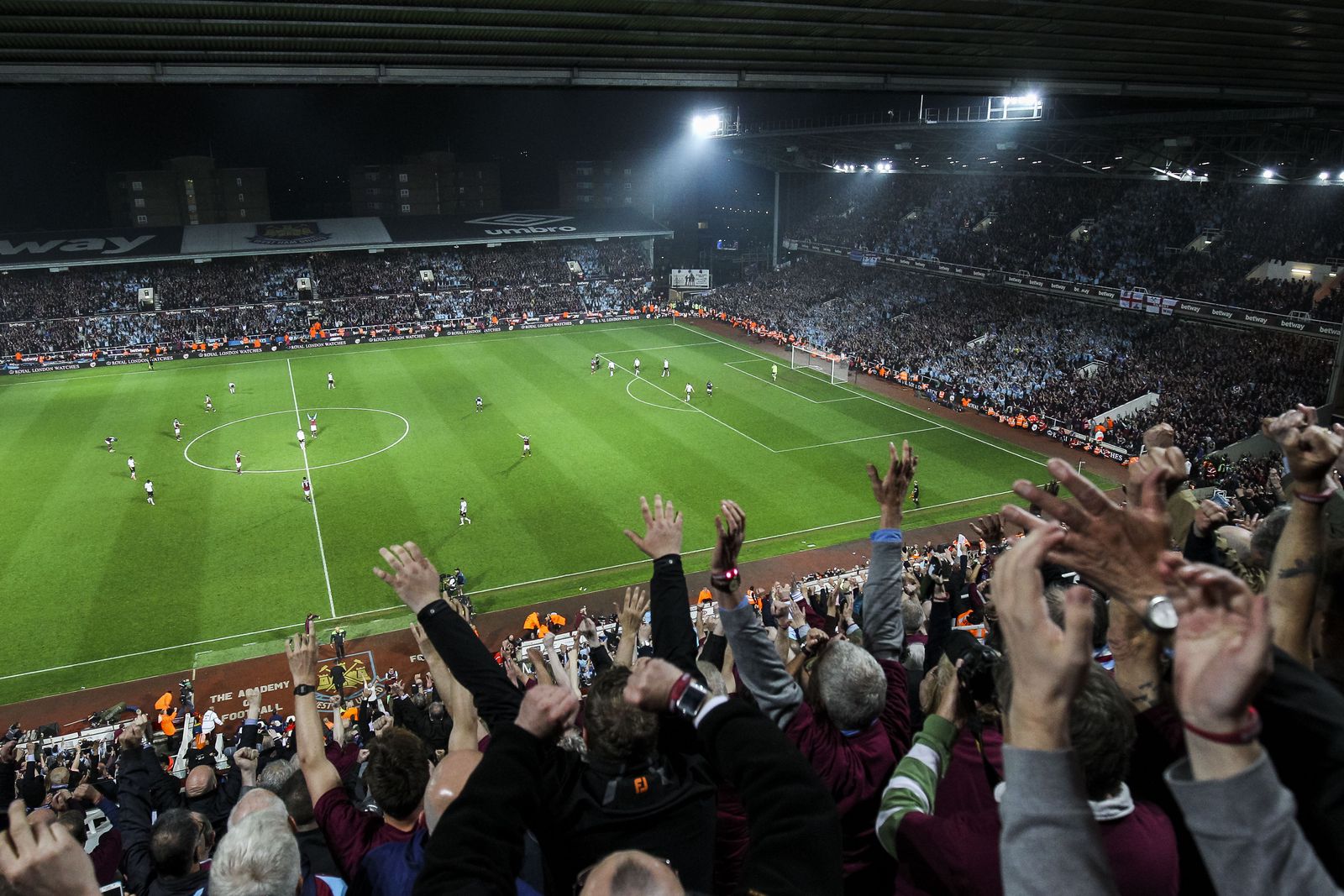 West Ham fans celebrate at the final whistle of the last ever match at the Boleyn. I applied for accreditation but I was refused, so not wanting to miss out on the last match I bought a ticket and shot this from my seat at the final whistle. (16mm, ISO2500, 1/640th, f4)
