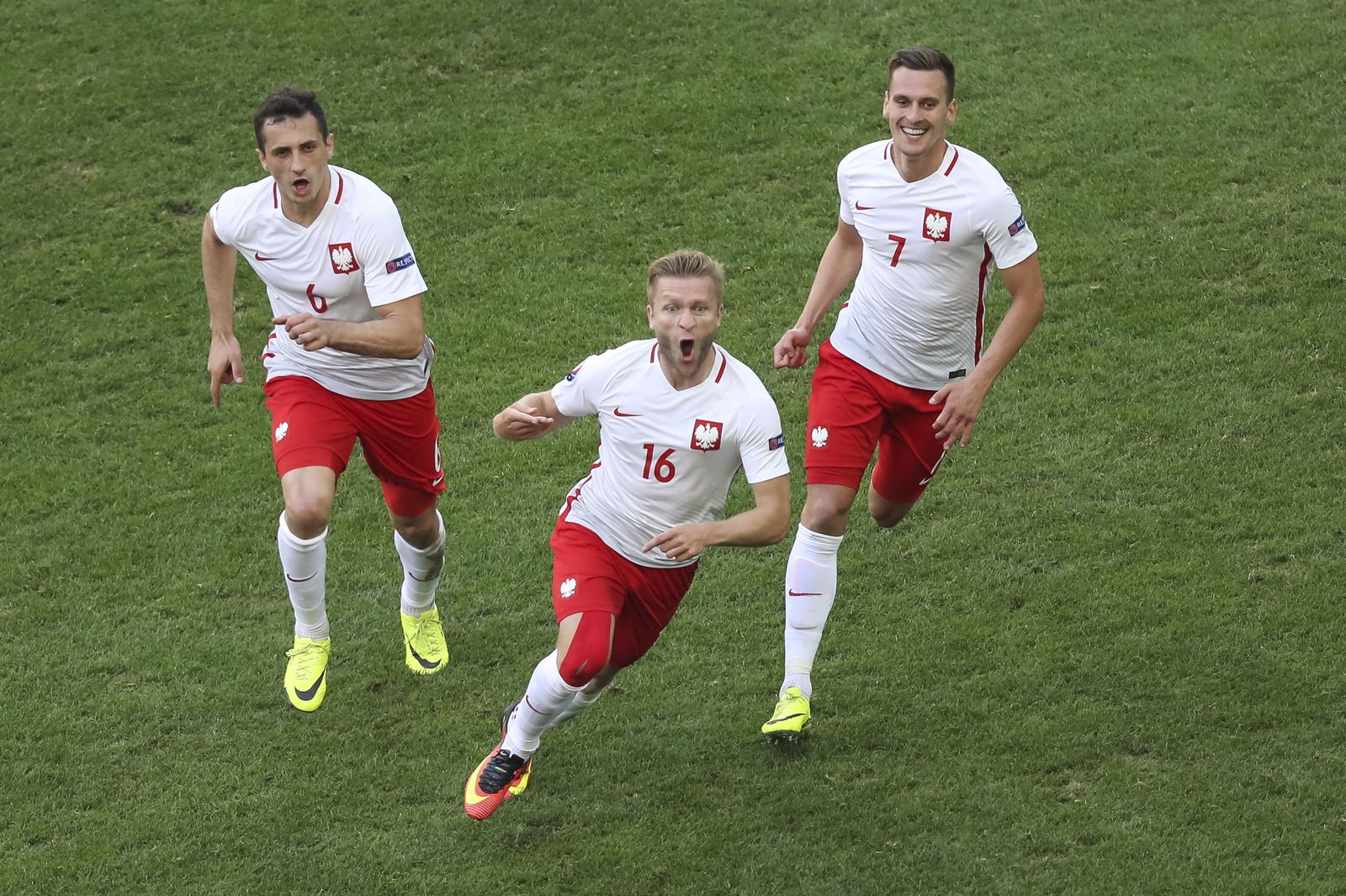 Poland’s Jakub Blaszczykowski celebrates scoring against Ukraine. (500mm, ISO2000, 1/1600th, f4)