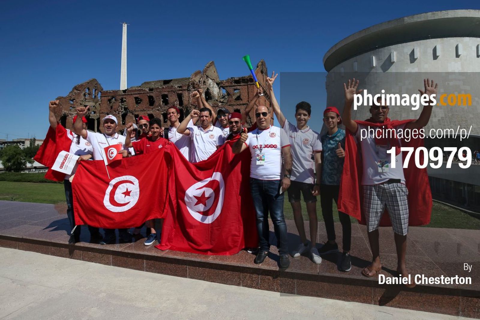 Tunisia fans pose in front of Grudinin’s Mill