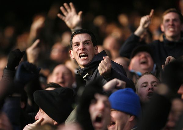 Portsmouth fans celebrate as they equalise against local rivals Southampton