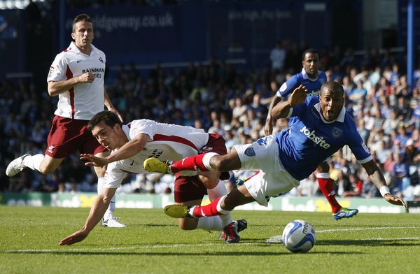 Portsmouth's Wes Thomas is fouled for a penalty