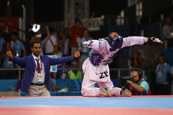 Azerbaijan's Aykhan Taghizade celebrates after winning Taekwondo gold