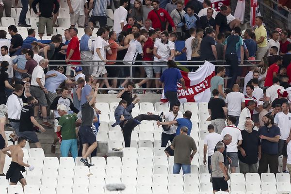 Russian fans storm the England end after the match