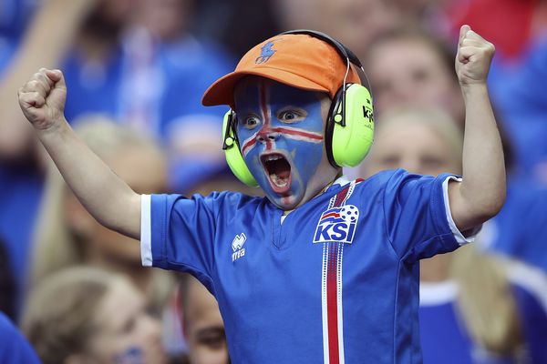 A young Iceland fan cheers on his side during Euro 2016