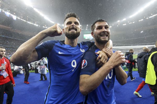 Olivier Giroud and Andre Pierre Gignac celebrate victory over Iceland