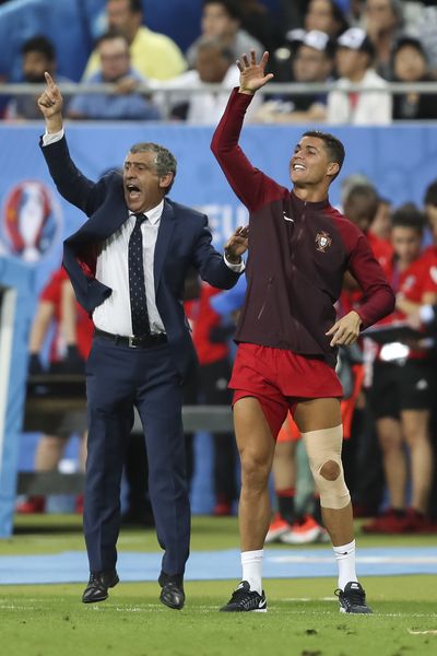 Portugal Manager Fenando Santos and Cristiano Ronaldo give instructions during the final