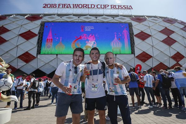 Argentina fans pose in Lionel Messi, Cristiano Ronaldo and Vladimir Putin masks