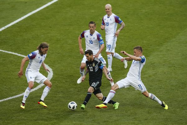 Lionel Messi of Argentina takes on the Iceland defence