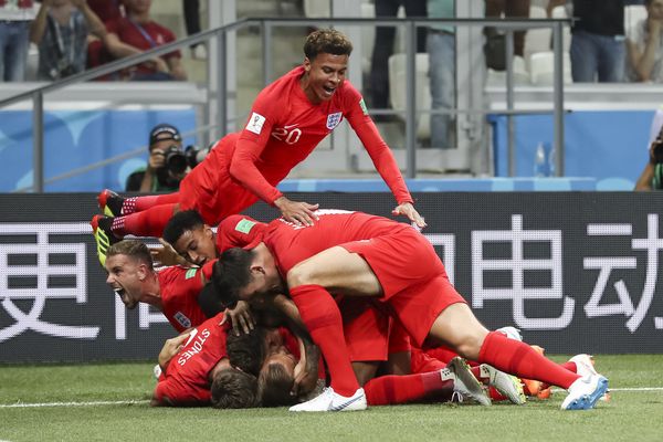 Dele Alli dives on Harry Kane after England's first goal against Tunisia