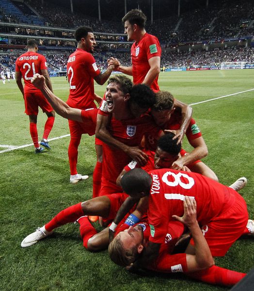 Harry Kane celebrates his stoppage time winner against Tunisia