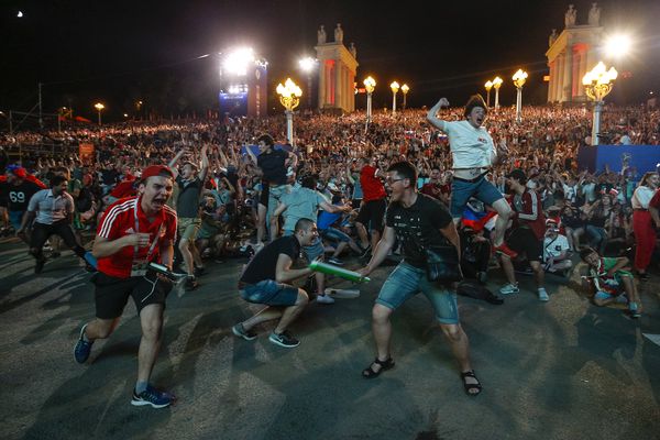 Russian fans celebrate their third goal against Egypt at a FIFA Fan Fest in Volgograd