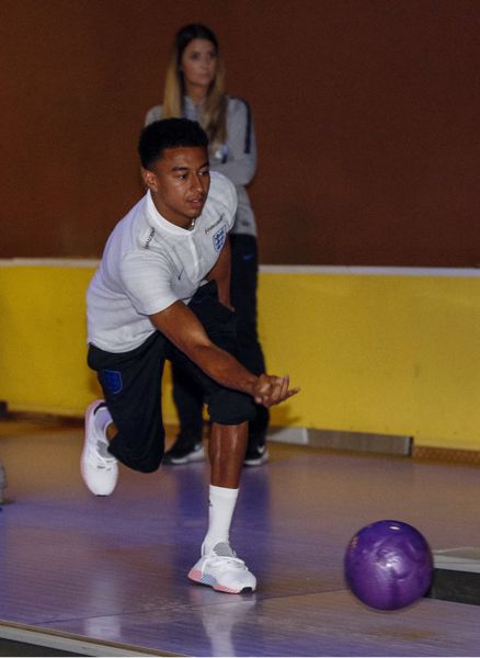 Jesse Lingard bowls after an England press conference in Repino, Russia
