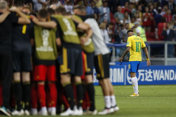 Neymar of Brazil looks dejected after losing to Belgium