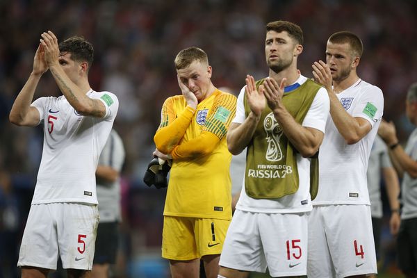 England players look dejected after they lose the 2018 FIFA World Cup Semi Final against Croatia