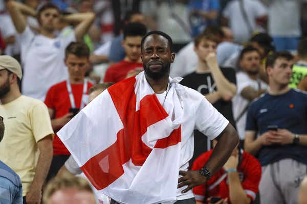 An England fan in tears after they lose the 2018 FIFA World Cup Semi Final against Croatia