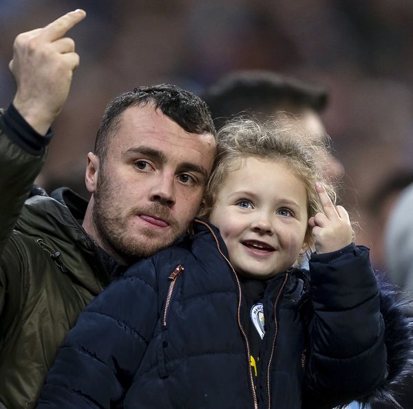 A young Manchester City fan gives Sheffield United the finger