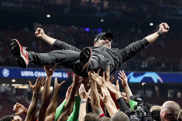Jürgen Klopp is thrown in the air after their Champions League win in Madrid
