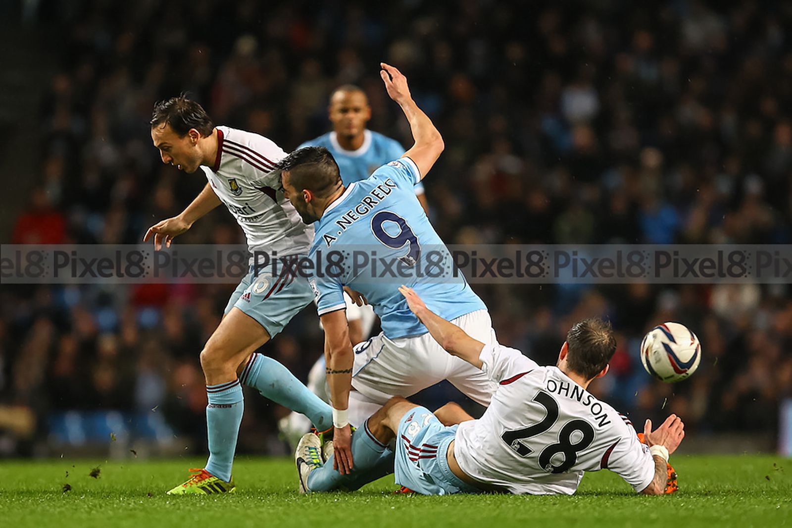 Mark Noble, Negredo and new signing Roger Johnson compete for the ball