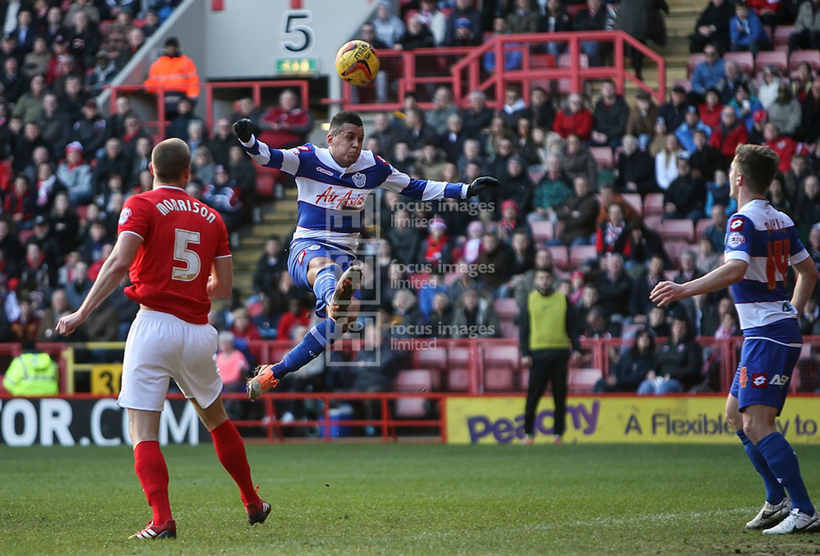 New signing Ravel Morrison jumps for a cross but misses