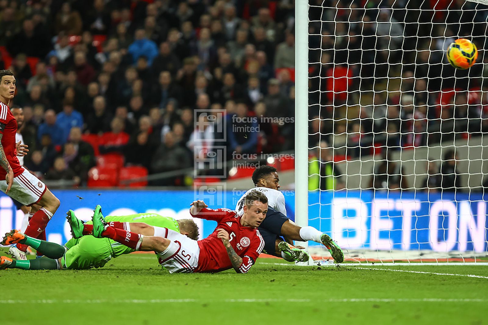 Sterling beats the Denmark defence but can only hit the post