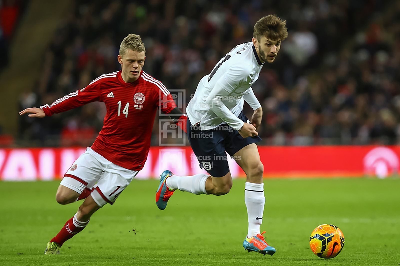 Adam Lallana takes on Kasper Kask