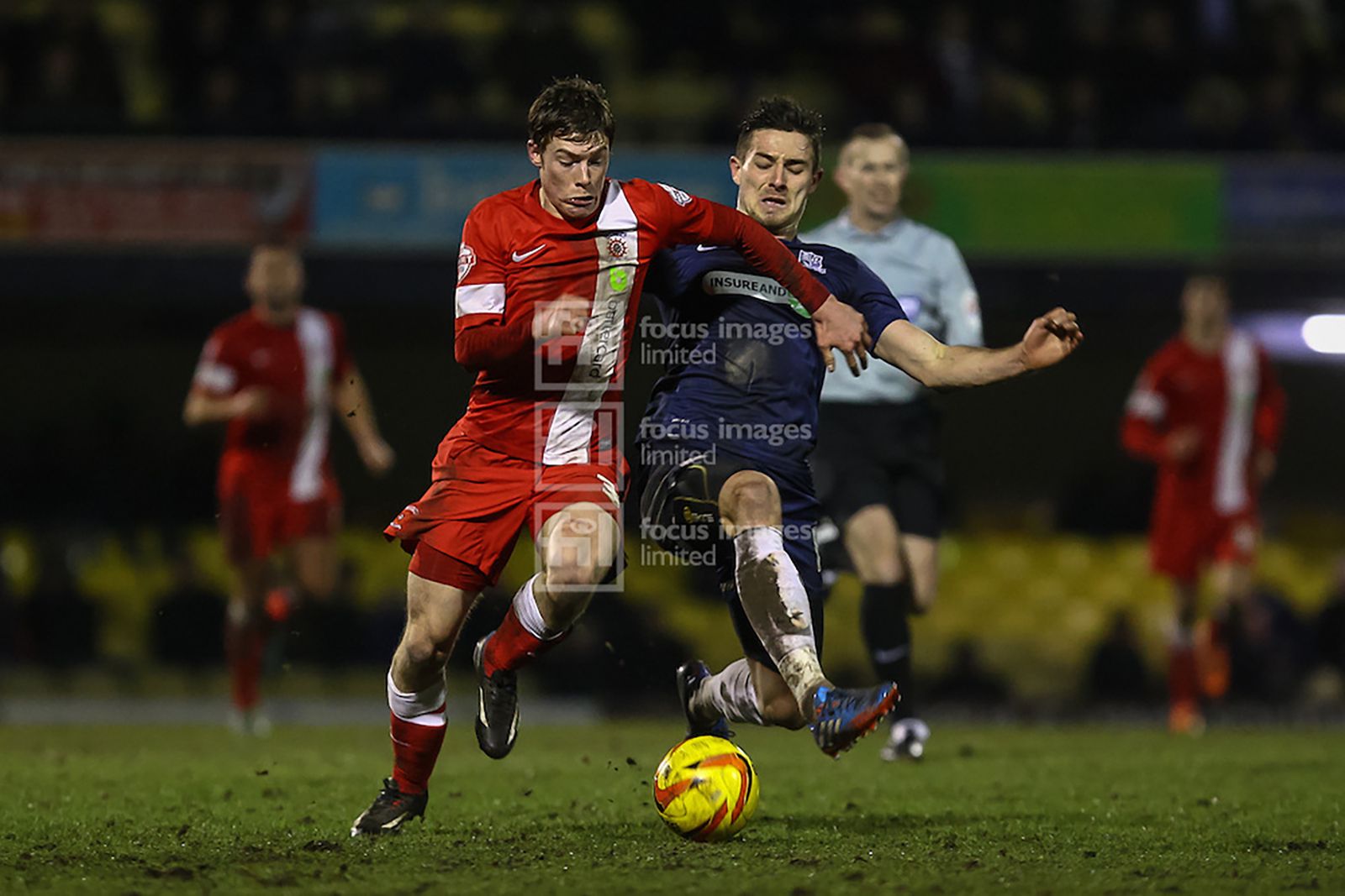 Hartlepool’s Luke James (left) is fouled by Ryan Leonard