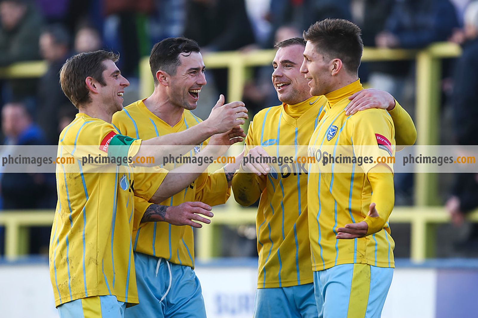 Canvey players celebrate after John Sands (right) puts them 2-1 up against Carshalton