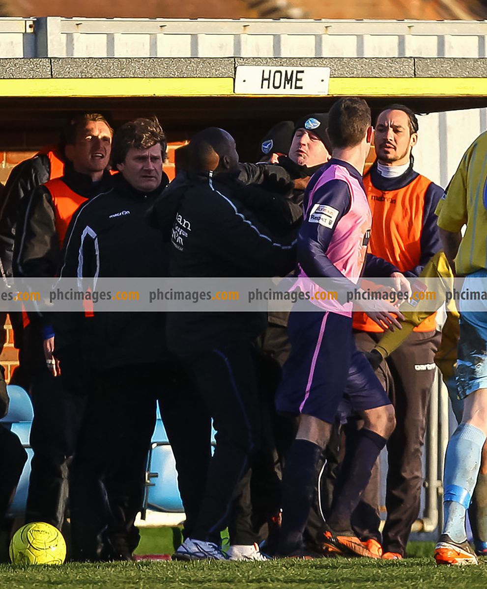 The Dulwich and Canvey managers clash before being sent off