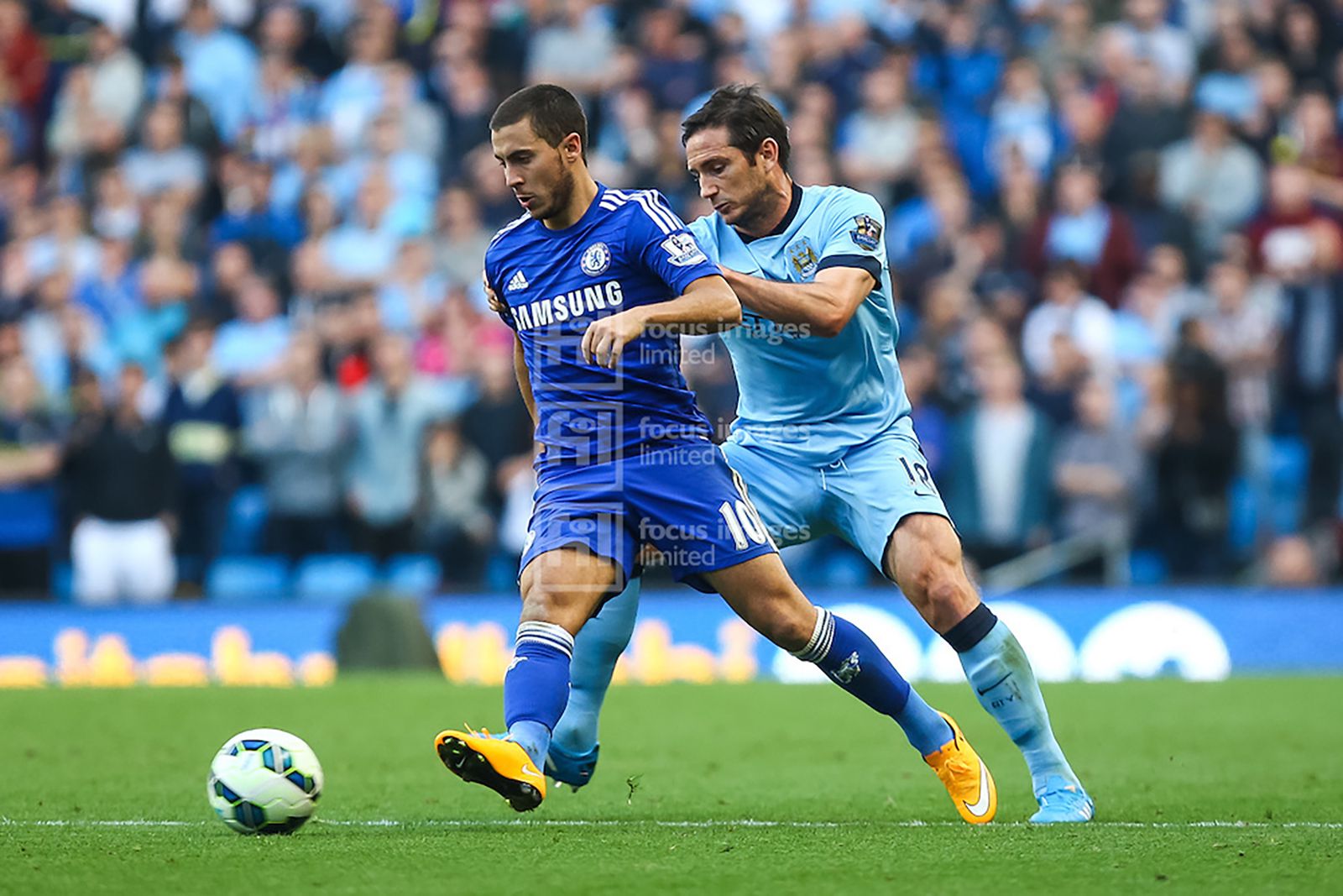 Hazard shields the ball from Lampard