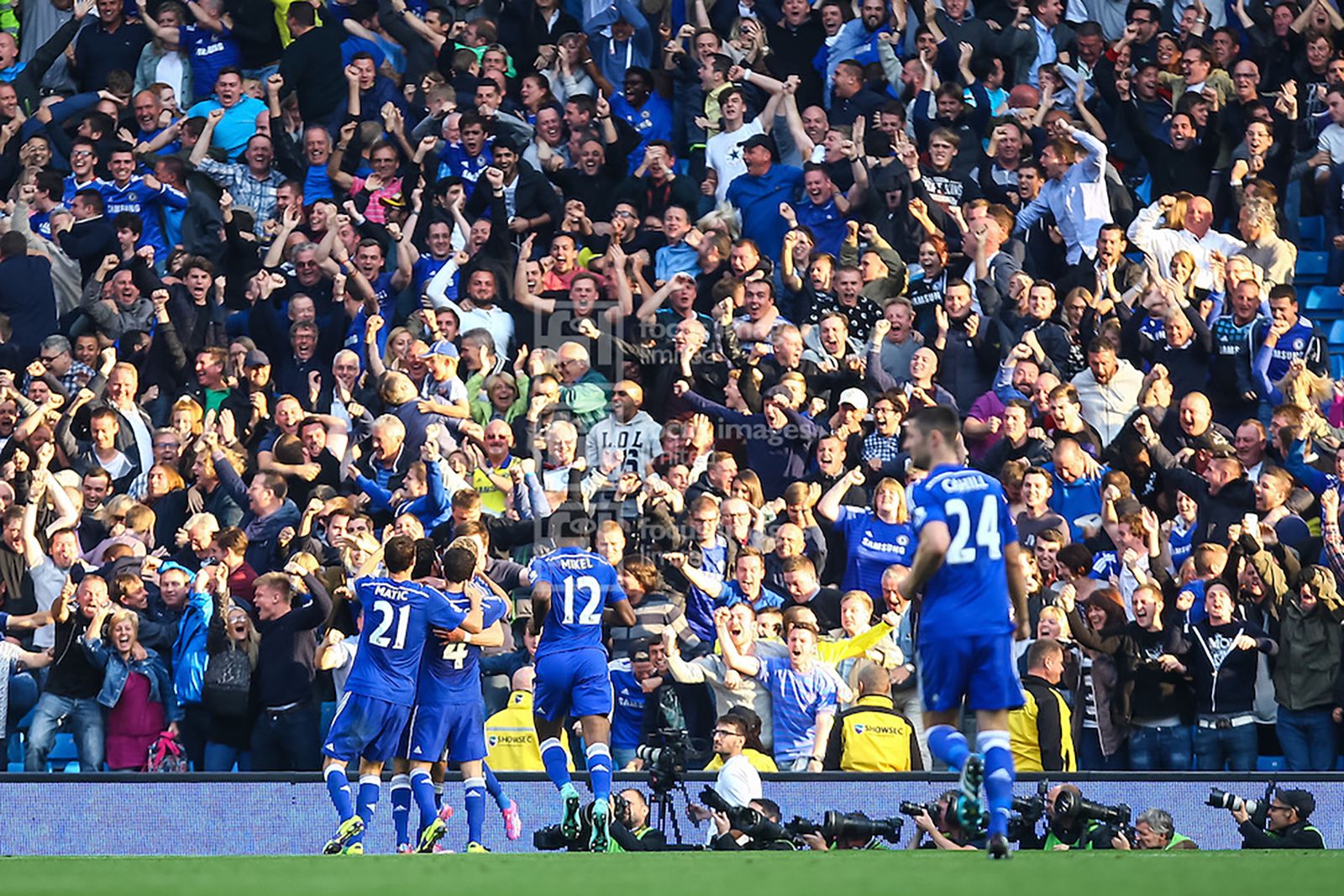 Schürrle celebrates in front of the travelling fans and the photographers at that end who got some great photos