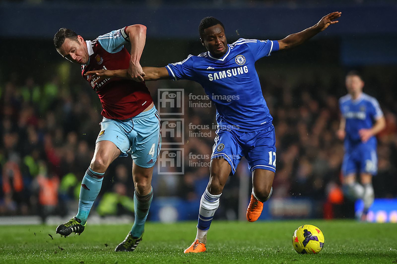 Kevin Nolan and John Obi Mikel compete for the ball