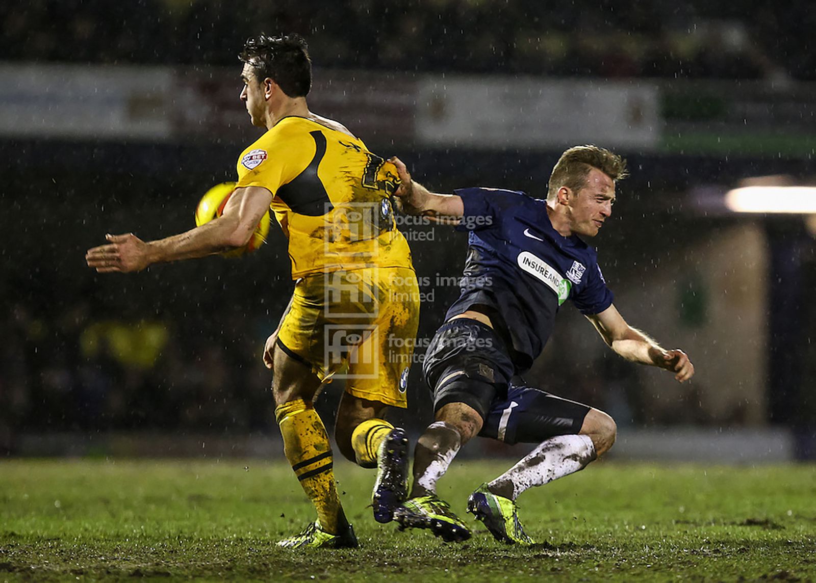 Andy Sandell and Lee Barnard compete for the ball