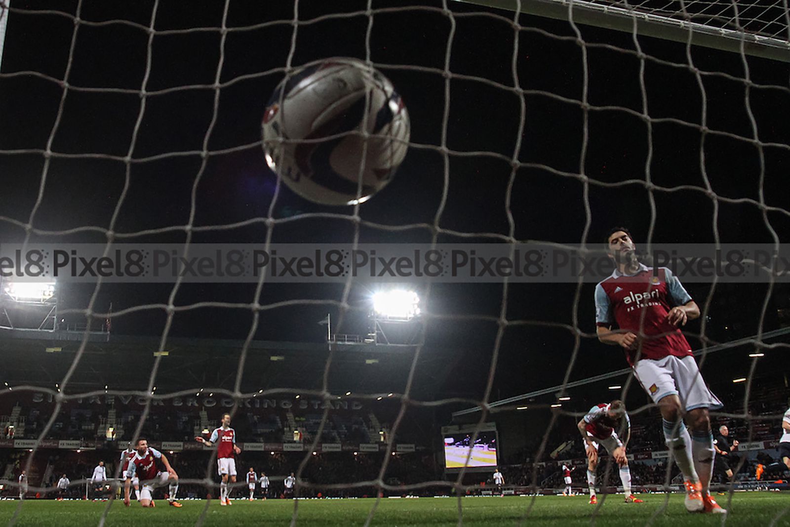 James Tomkins reacts as Agüero (not pictured) puts City 2-0 up