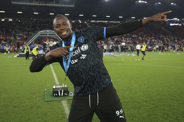 Usain Bolt celebrates after winning Soccer Aid