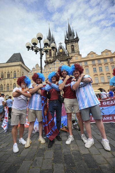 Fans pose in the centre of Prague