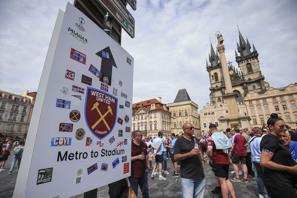 A sign shows the route to the stadium