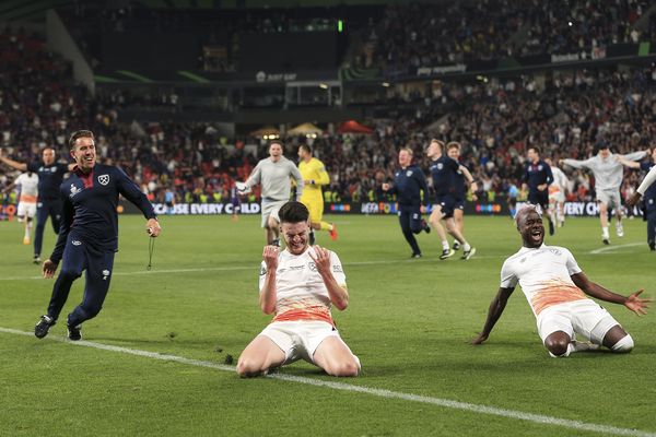 Declan Rice slides on his knees after the final whistle