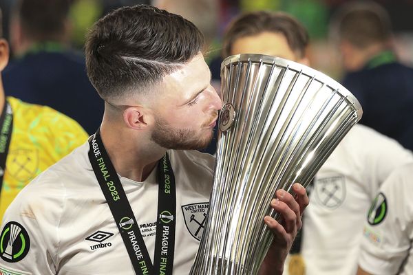 Declan Rice kisses the trophy