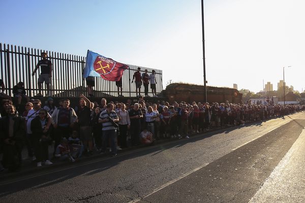 West Ham fans wait for the parade bus