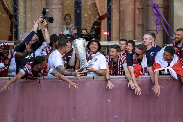 Mark Noble celebrates with the trophy