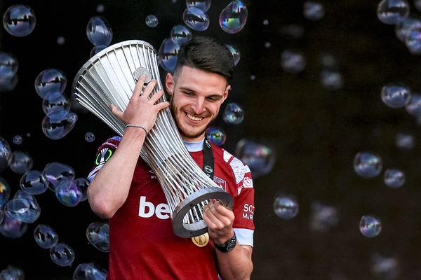 Declan Rice poses with the trophy